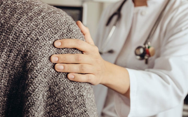 Woman meeting with female doctor