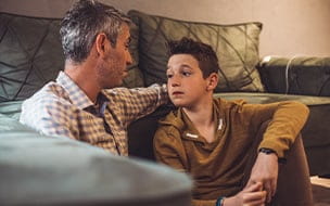 A father and son having a serious discussion