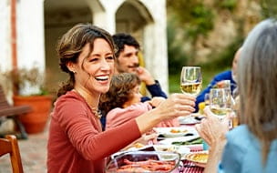 woman drinks wine at party
